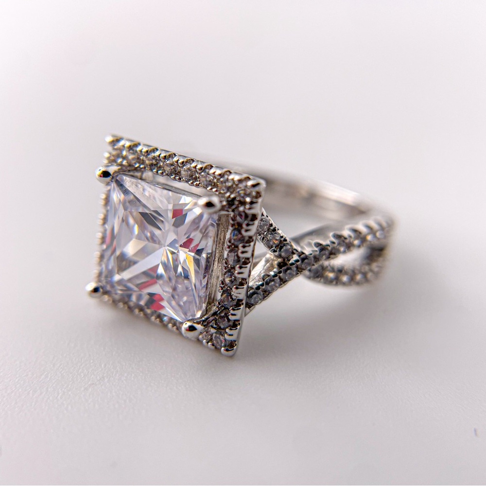 Radiant cut cubic zirconia silver tone ring. Size 6.